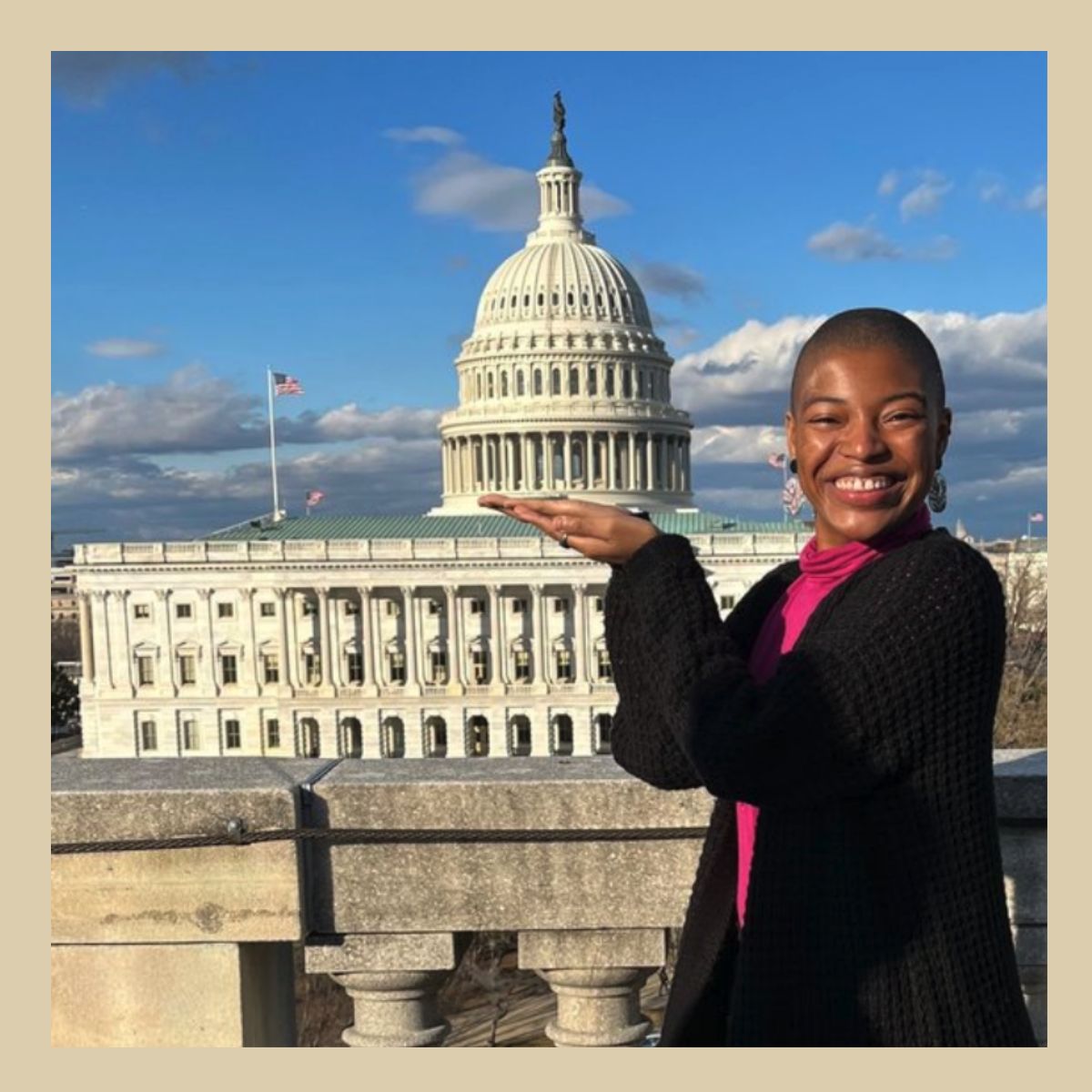 A smiling Lalah Williams in front of the United States Capitol building