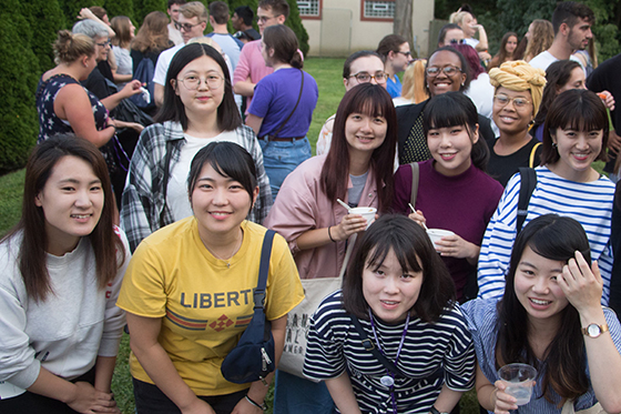 Photo of a group of international students eating ice cream on Chatham University's campus