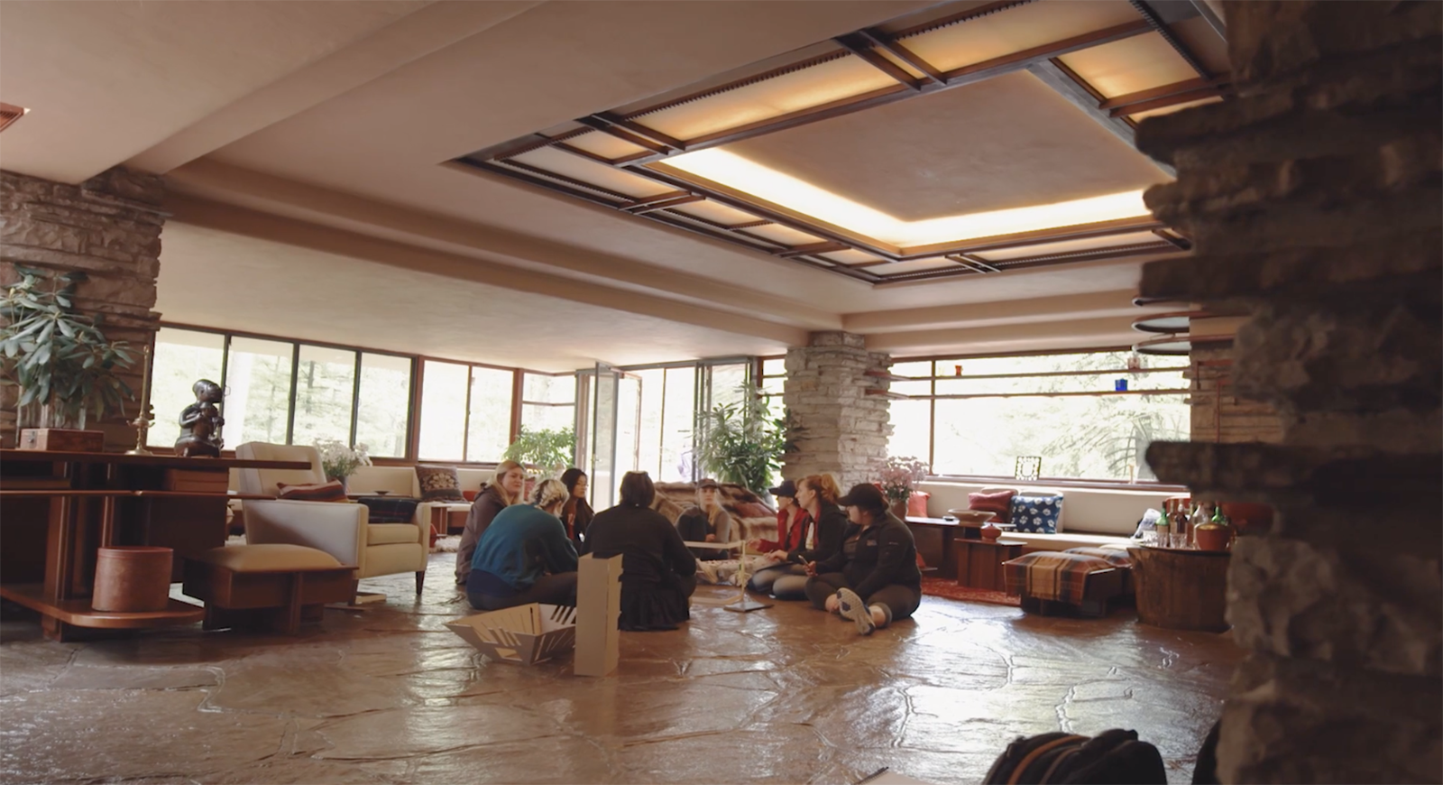 Photo of Chatham University students sitting in a circle at Fallingwater