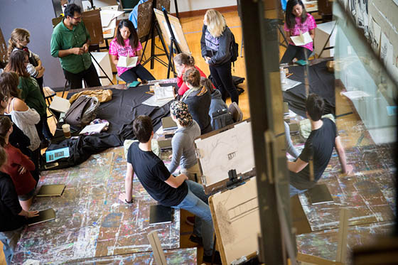 Photo from above of Chatham University students in an art class