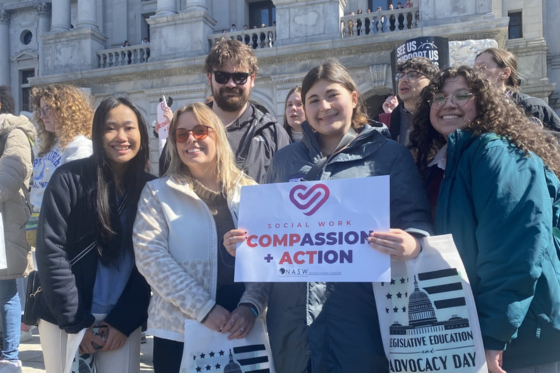 Photo of four Chatham University students walking out of Jennie Mellon King Library together. 