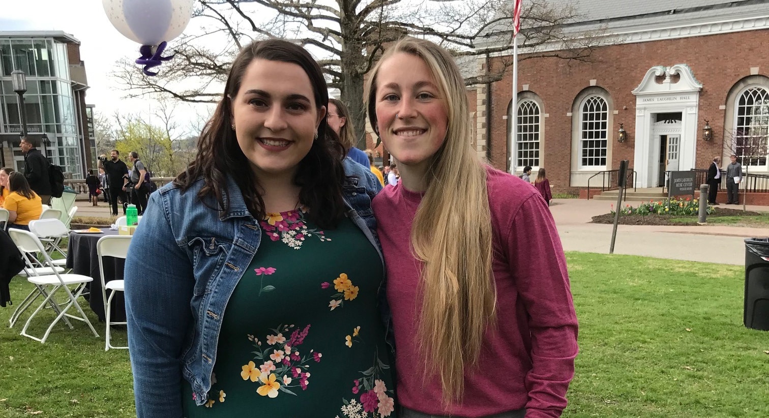 Photo of two Chatham University students posing together outside at the Maggie Hobbs Award reception. 