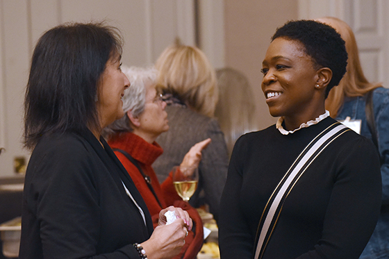 Photo of two women speaking at a networking event at Chatham University