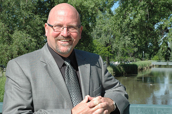 Photo of a Chatham University student looking at her laptop in Cafe Rachel.