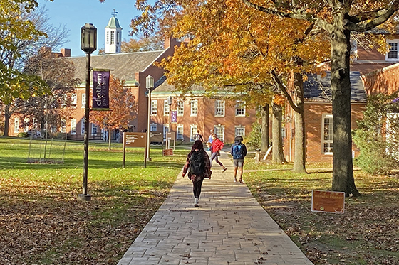 Photo of students walking across the Shadyside Campus quad in autumn