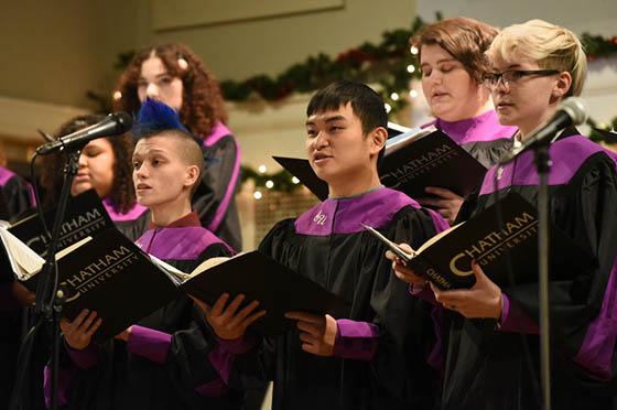 Photo of the Chatham Choir wearing Chatham robes, performing during Candlelight