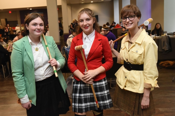 Photo of Chatham University students dressed up for Halloween as the three Heathers from the Winona Ryder movie, Heathers
