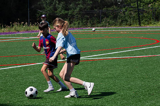 Kids playing soccer during Chatham's Sports Camp